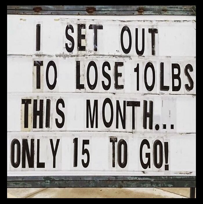 Sign humorously depicts dieting frustrations: "I set out to lose 10lbs this month... only 15 to go!"