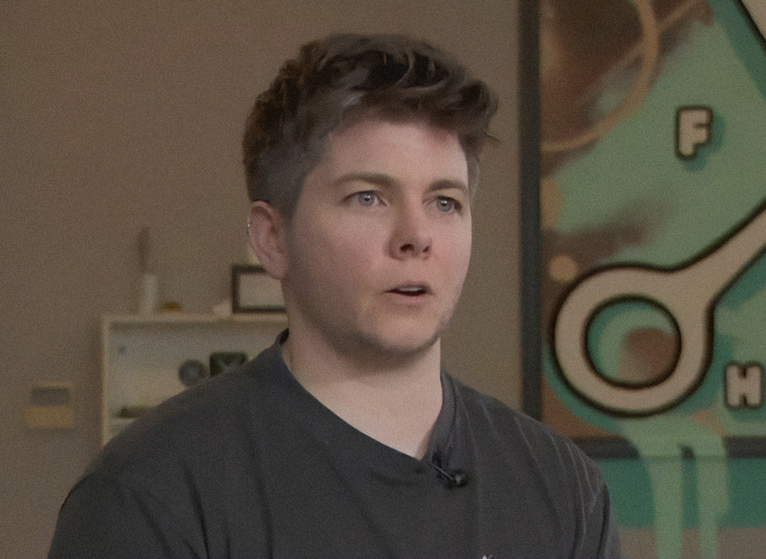 Jules Heron in salon creates inclusive haircuts, ensuring a safe space for all clients.