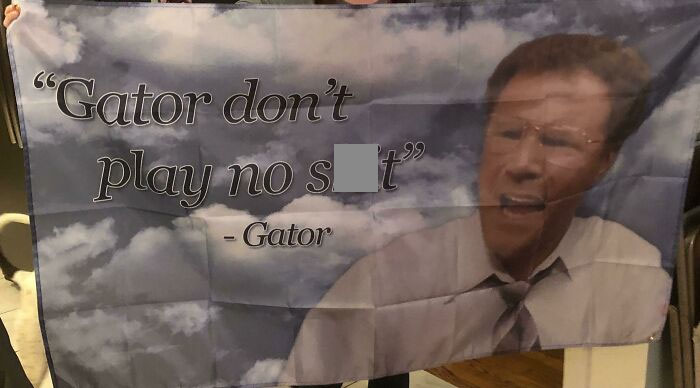 Hilarious trolling Christmas gift featuring a comedic quote on a flag with a man's face in the background.