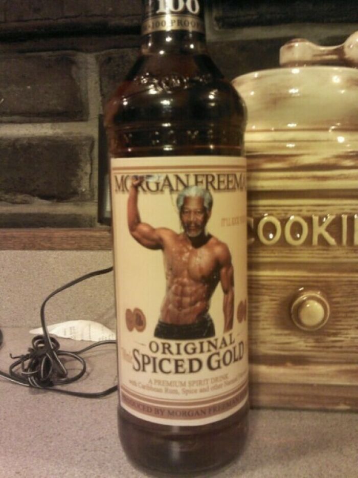 A bottle of spiced rum with a humorous custom label as a funny Christmas gift.
