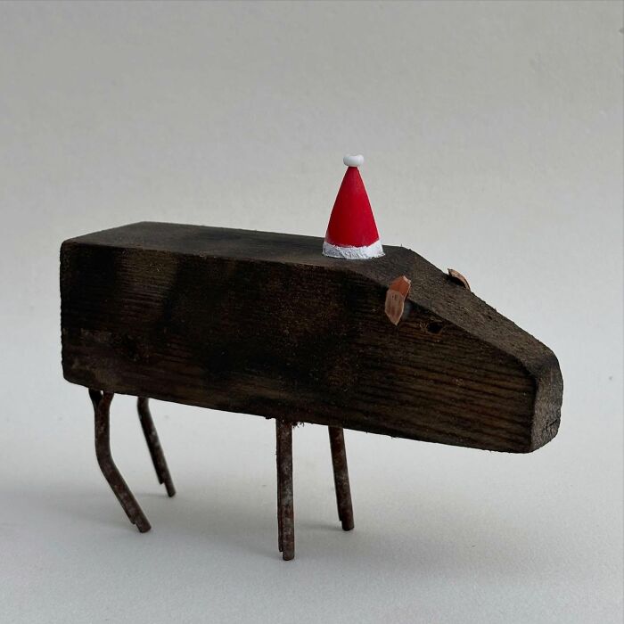 Driftwood animal sculpture with a red Santa hat by Kirsty Elson.