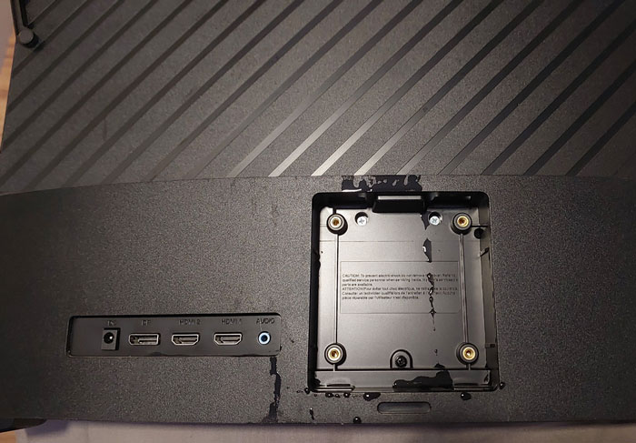 Damaged TV with missing mount, causing frustration for family members.