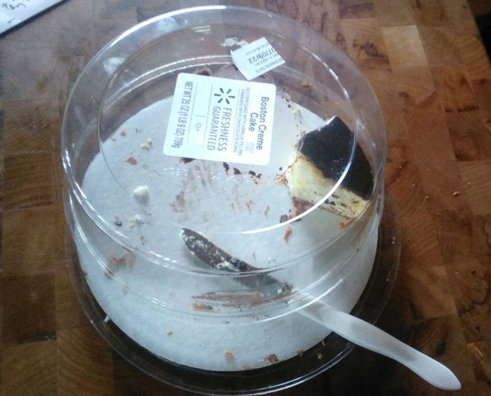 Empty cake container with one slice left, illustrating infuriating family members who finish desserts.