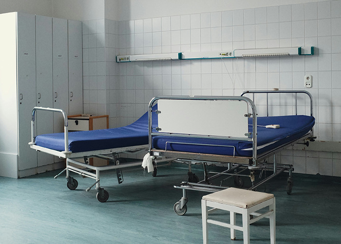 Empty hospital room with bed, representing a real-life insurance horror story.