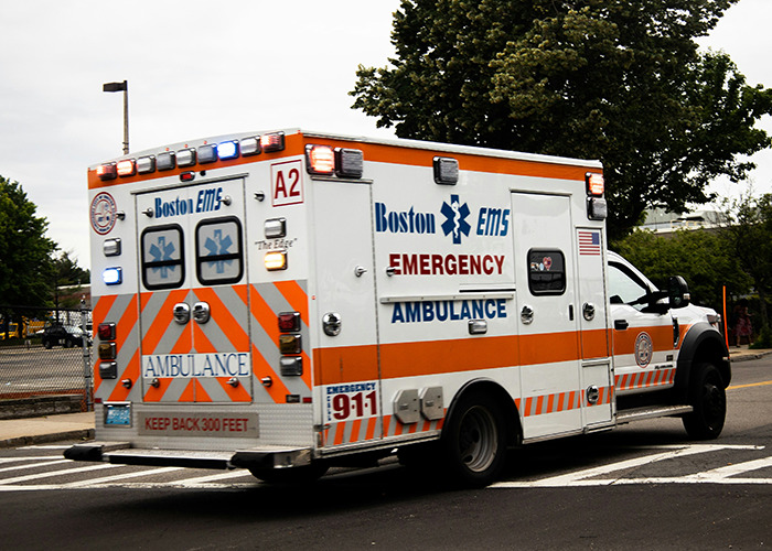 Ambulance on a road, related to real-life insurance horror stories.