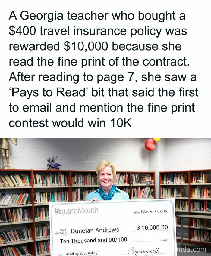 Teacher rewarded $10,000 for reading fine print, holding a large check in a library.