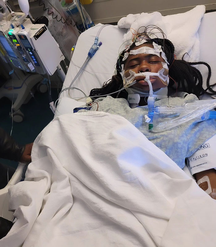 Kelaia Turner in hospital bed with medical equipment, highlighting bullying consequences. Kelaia Turner in hospital bed with medical equipment, highlighting bullying consequences.