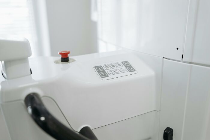 Control panel on a machine, illustrating left-handed people struggles.