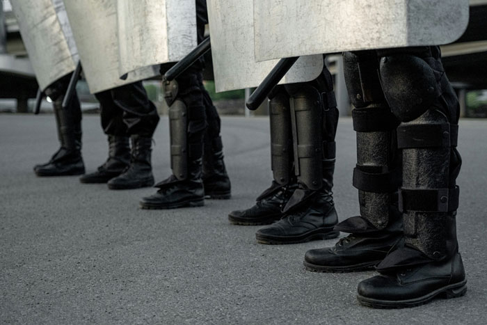 Riot police in formation with shields during martial law in South Korea. Riot police in formation with shields during martial law in South Korea.