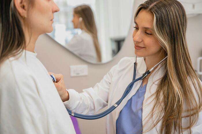 Healthcare professional using a stethoscope for a check-up, illustrating current medical practices.