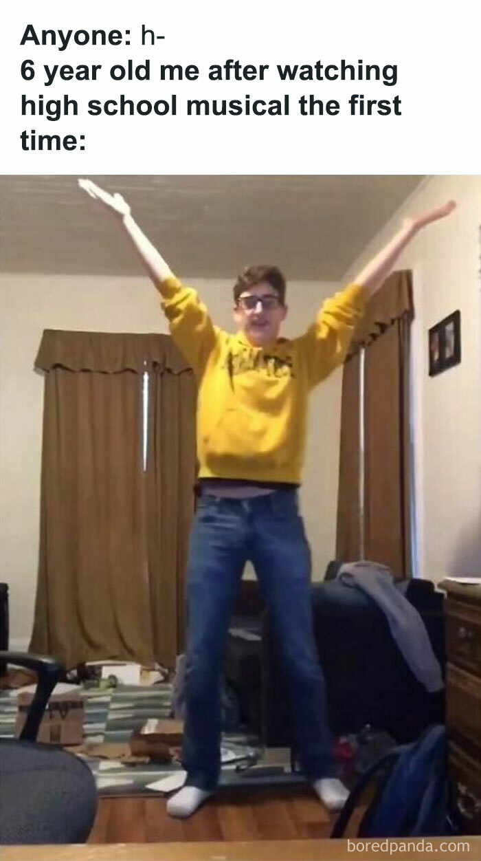 Boy in a yellow sweater, arms raised in excitement, captures the nostalgic joy of childhood shows.