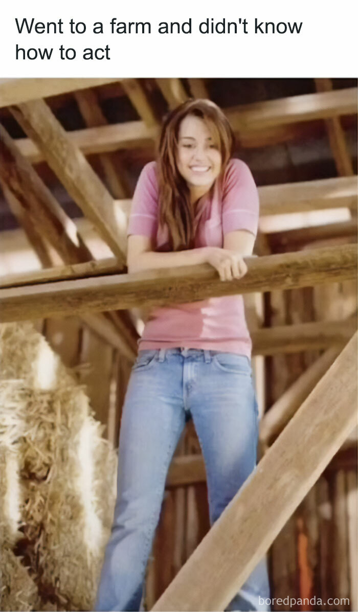 Smiling person in a barn setting, reminiscent of nostalgic childhood shows.