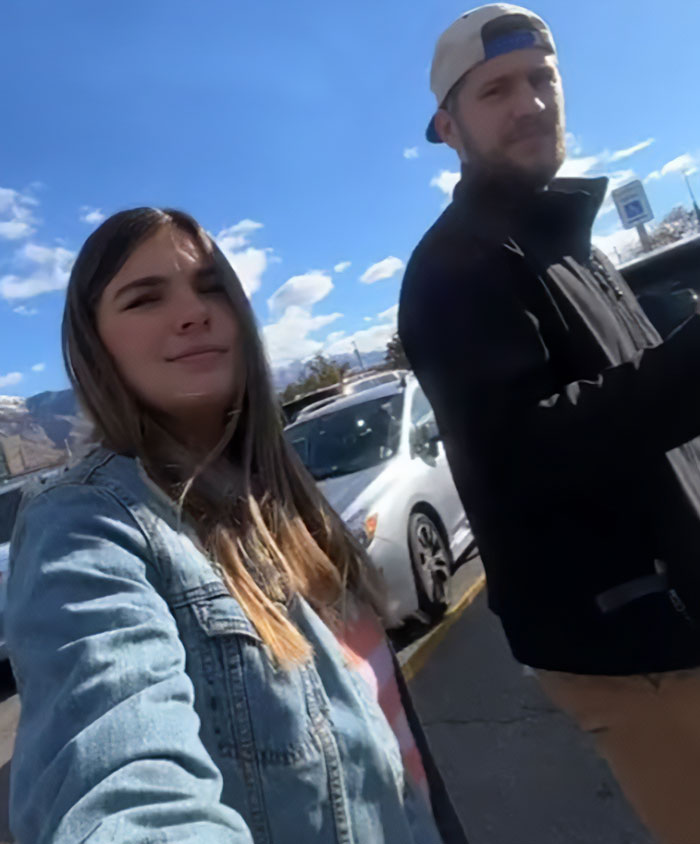Man and woman outdoors, with a car in the background, related to controversial video momfluencer investigation.