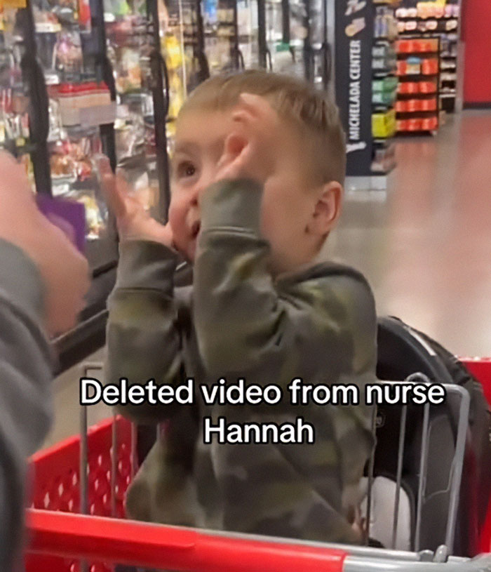 Boy flinching in a shopping cart, linked to momfluencer controversy video.