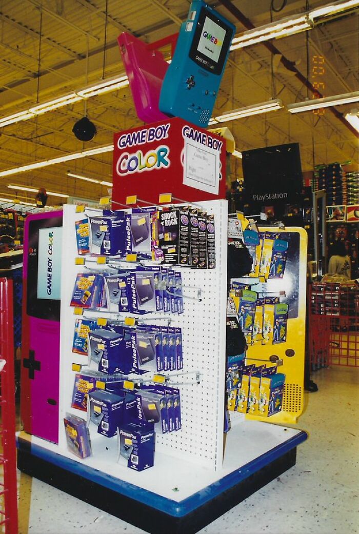 Retro display of Game Boy Color accessories in a store, capturing an old-internet feel.