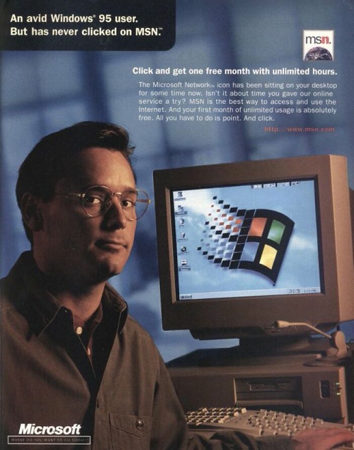 Man with glasses beside a vintage computer running Windows 95, evoking old internet feel.