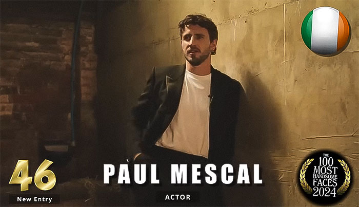 Actor ranked 46th in 'Most Handsome Men 2024' by Independent Critics, wearing a black jacket and white shirt.