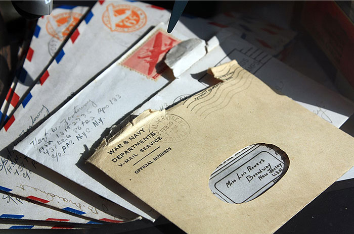Vintage letters scattered, revealing Hollywood secrets on aged envelopes, hinting at untold stories.