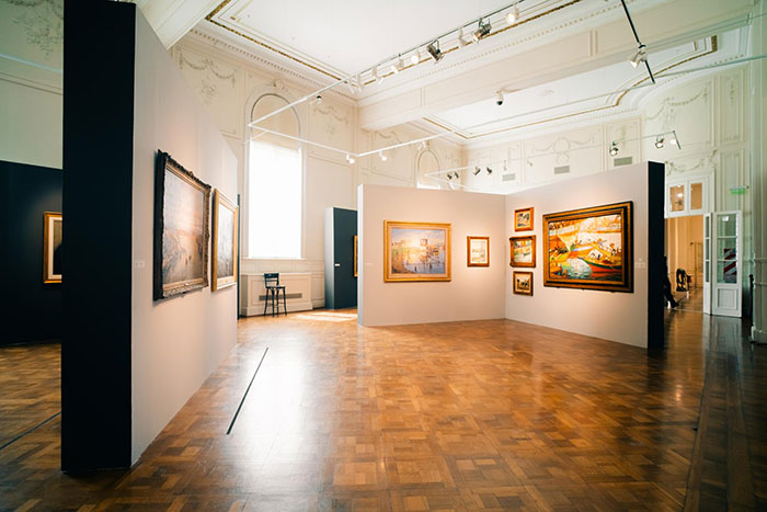 Art gallery interior, showcasing paintings, represents jobs with little work effort.