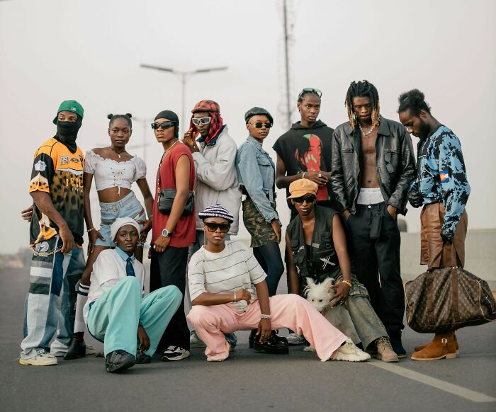 Group of fashionable individuals showcasing Pinterest trends for 2025, posing confidently in urban streetwear styles.