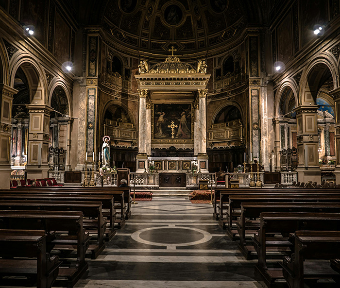 Church interior with empty pews, highlighting religious architecture, related to holiday billboard discussions. Church interior with empty pews, highlighting religious architecture, related to holiday billboard discussions.