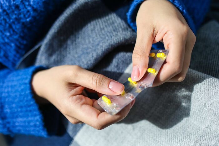 Hands holding a blister pack of pills, related to health myths debunked by medical professionals.