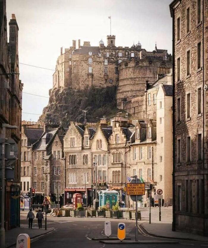 View of Edinburgh Castle and historic buildings exemplifying Scotland's charm.