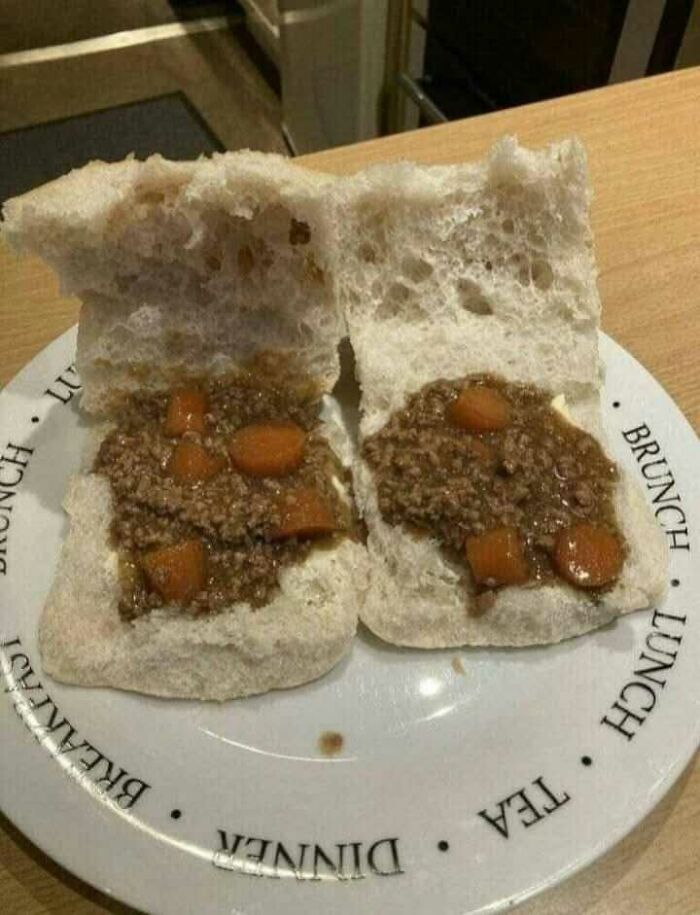 Scottish dish with mince and carrots on a bread roll, served on a plate labeled for various meals.