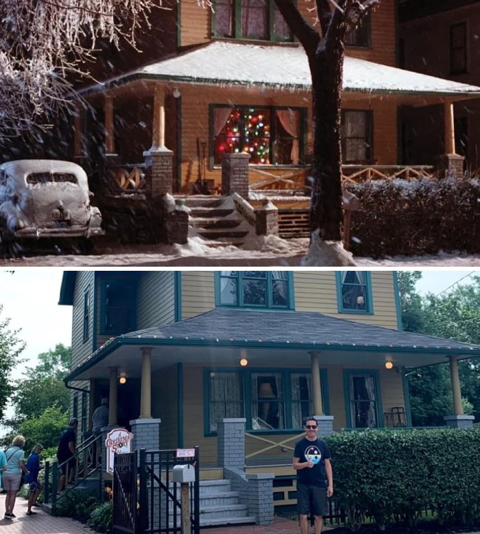 Famous movie location house with Christmas decorations in winter scene and modern-day visitors outside.