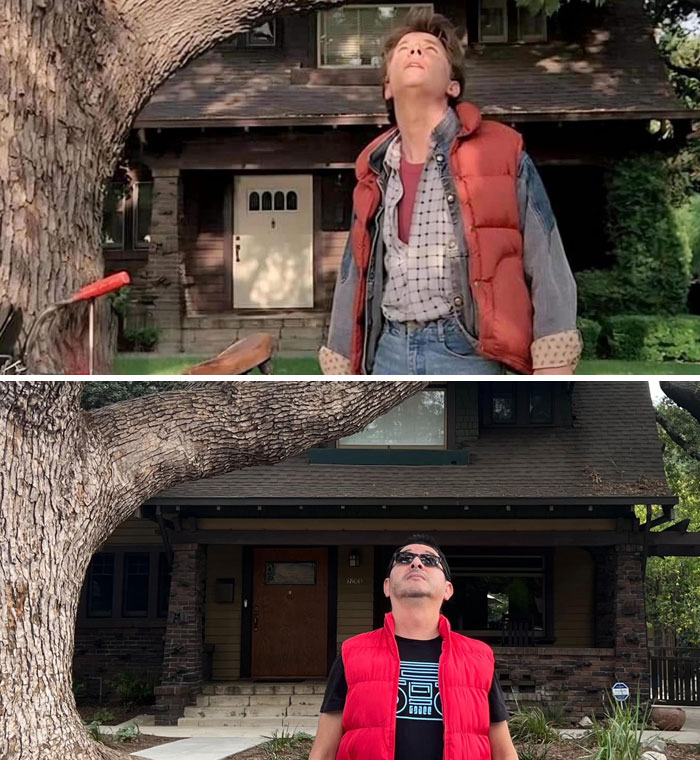 Famous movie location with actor in red vest near iconic house from a popular film scene.