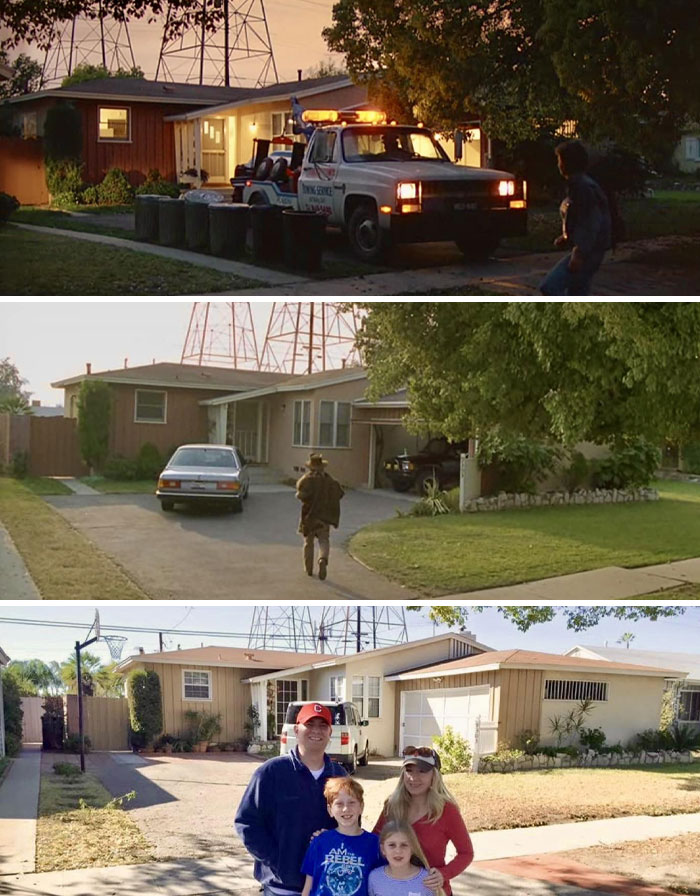 Famous filming location with family posing in front of a house featured in a popular movie.