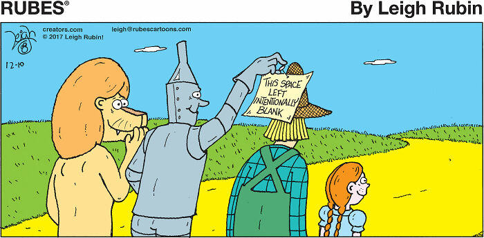 Comic panel of Wizard of Oz characters with the Tin Man holding a sign in a funny Wicked-inspired scene