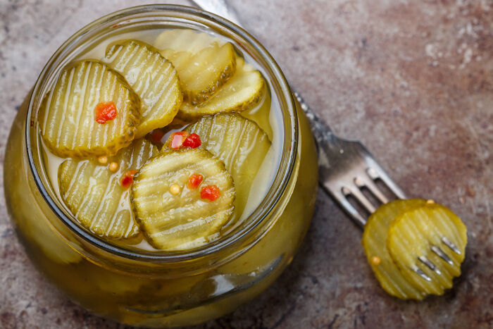Jar of pickles with spices, highlighting future trends prediction for 2025 by Pinterest.