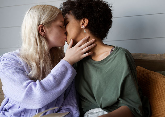 A couple kissing, discovering new things about each other after marriage.
