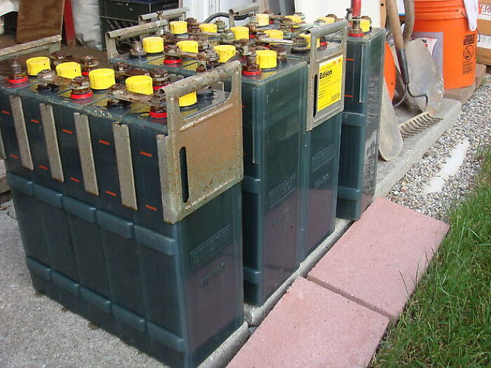 Batteries lined up on a driveway, part of strangest delivery stories.
