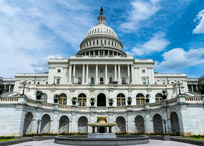 U.S. Capitol building under a bright blue sky, representing a symbol of power people might regret wishing for.
