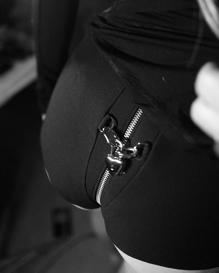 Close-up of a bizarre zipper design on black fabric, showcasing unusual social media content.