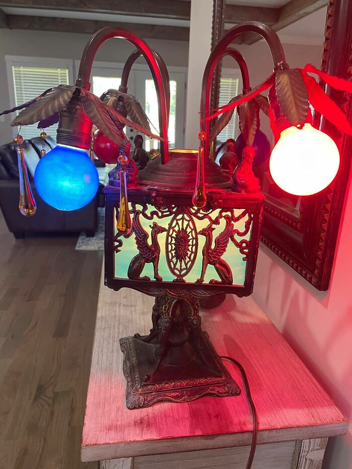 Vintage ornate lamp with colorful lights, showcasing a strange and spectacular second-hand discovery.