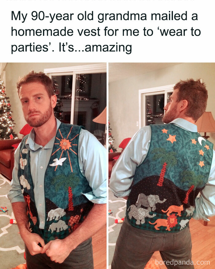 Man wearing a handmade animal-themed vest, a gift from his grandmother, posing in a living room to capture wholesome moments.