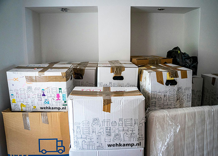 Moving boxes stacked in a room, symbolizing family boundary challenges. Moving boxes stacked in a room, symbolizing family boundary challenges.