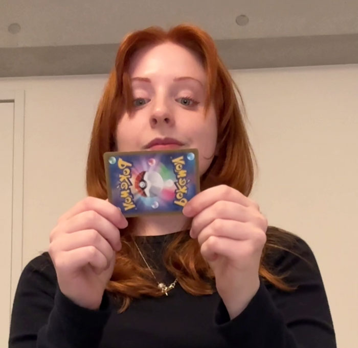 Woman holding a card, highlighting work rules in Japan. Woman holding a card, highlighting work rules in Japan.