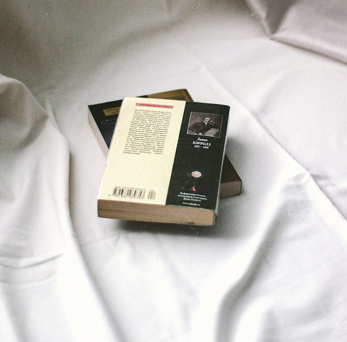 Books on a white sheet, representing Christmas presents that ruined holiday spirit.