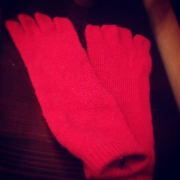 Red woolen socks as Christmas gifts symbolizing ruined holiday spirit.