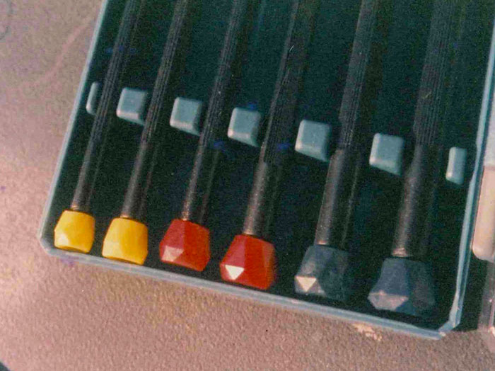 Colorful drawing pencils in a box, representing a Secret Santa gift idea.