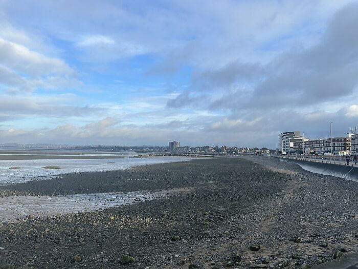 Coastal cityscape with overcast skies, representing a worst city-country trip experience.