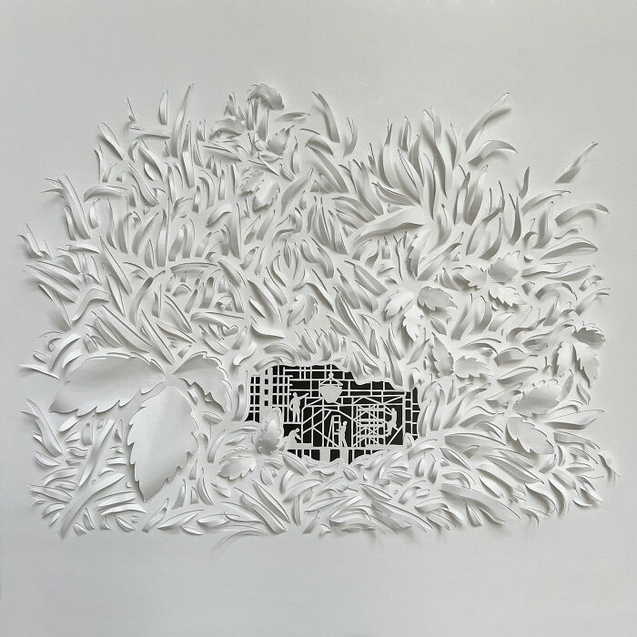 Intricate paper cut design showcasing a tree-less existence with detailed foliage and geometric shapes.