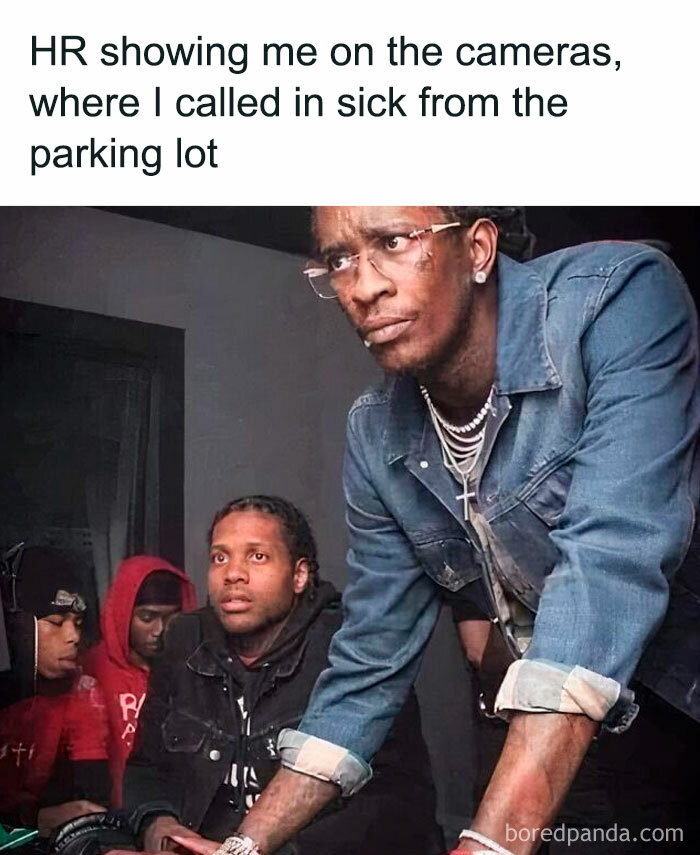 Man leaning over a desk with a focused expression, capturing a funny office moment.