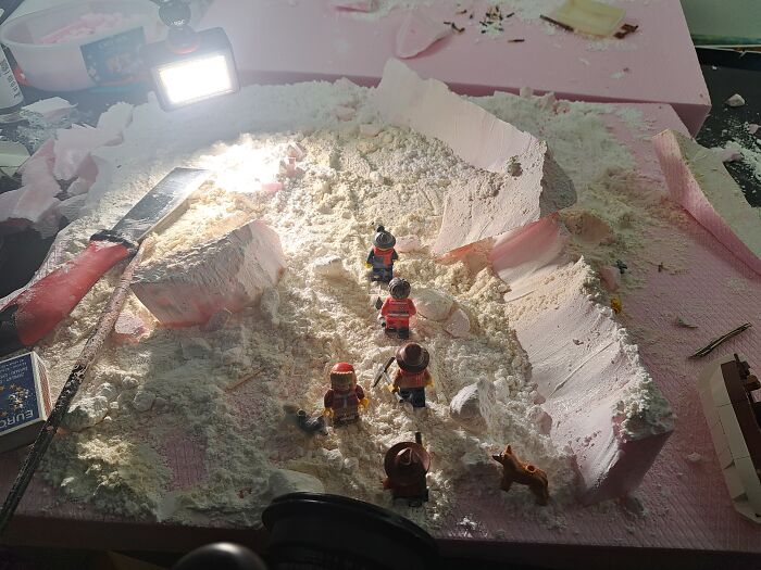 LEGO figures recreate the Trans-Antarctic Expedition scene with snow and ice elements on a model set.