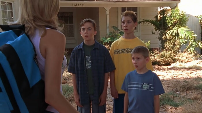 Children surprised outside a house, a scene from a beloved show known for its comedy.