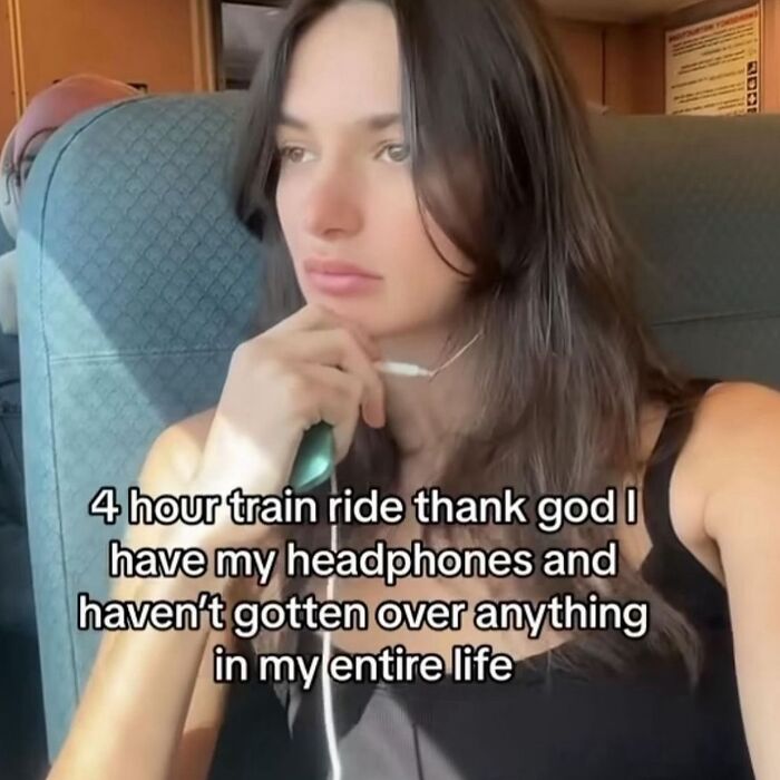 A woman on a train with headphones, accompanied by a funny meme text about long journeys and nostalgia.